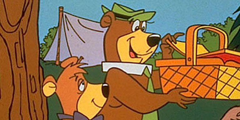 Yogi Bear and Boo-Boo enjoy a picnic basket and a dumb network card selection pun. (image property of Warner Bros.)